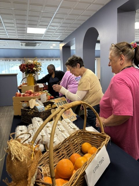 Residents choosing produce at a market
